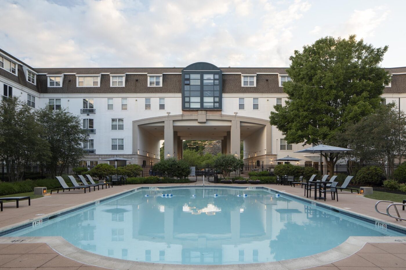 outdoor pool with white building facade