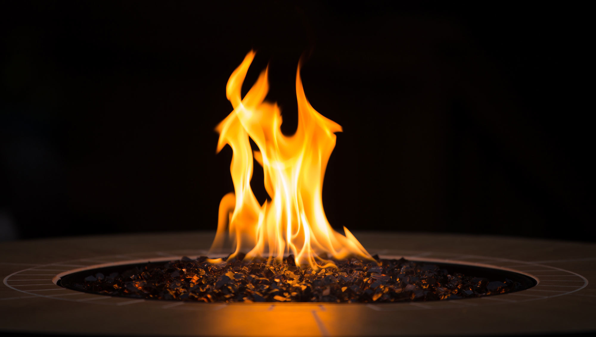 Lit fire pit with flame